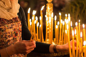 Why do we light orthodox church candles at church?